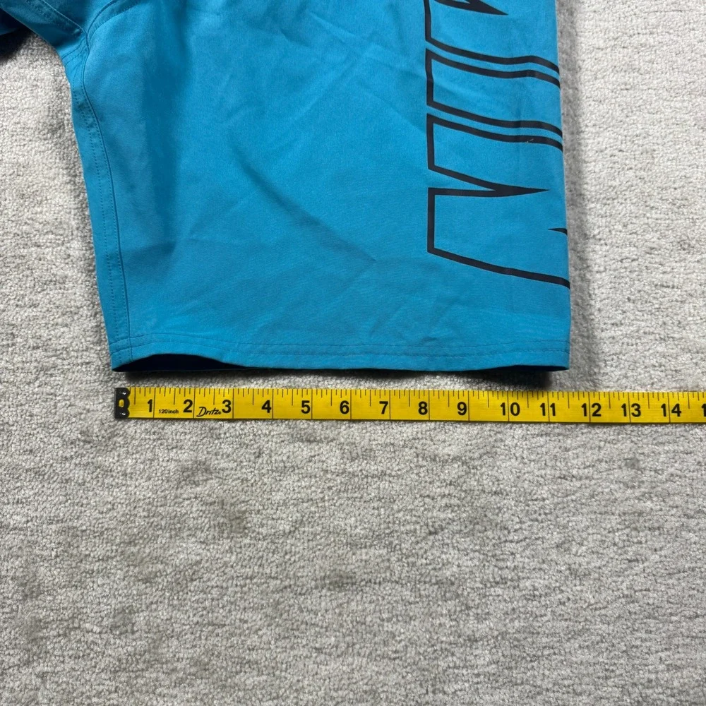 Nike Swim Trunks Mens Medium Teal Blue Logo Graphic Board Shorts 9 Inch Inseam
